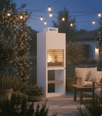 Sfeervolle Lotus tuinhaard op terras - Design buitenhaard brandend in de avond